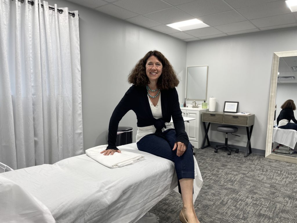 What constipation feels like Tips To Ease Your Pelvic Pain: Dr. Maureen O'Keefe sitting in the Purple Mountain Treatment Room